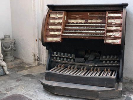 The vintage and dusty piano in traditional wood with pedalsの写真素材