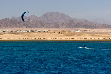 Kitesurfing on the background of the desert rocky shore. Egyptの写真素材