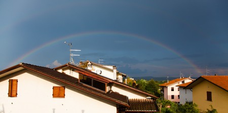 Rainbow over Roofs after the Stormの写真素材