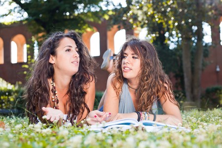 Two Young Woman Study Togheter at Parkの写真素材