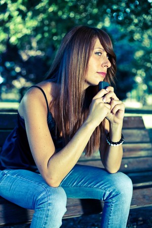 Young Woman Typing on the Phoneの写真素材