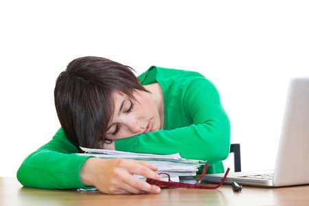 Tired Young Woman Sleeping at Workの写真素材
