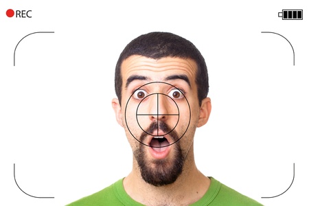 Young Surprised Man Captured with Video Camera