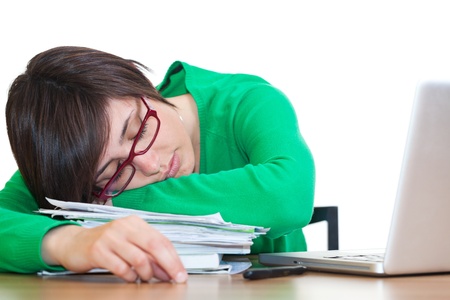 Tired Young Woman Sleeping at Workの写真素材