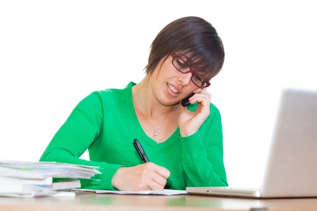 Busy Young Woman at Work in Officeの写真素材
