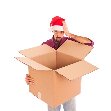 Young Man with Christmas Hat and Empty Boxの写真素材
