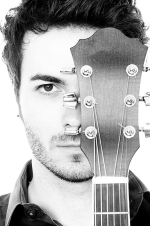 Young Man with Guitar Portraitの写真素材