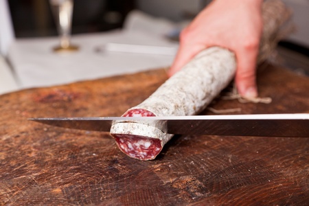 Butcher Slicing Salamiの写真素材