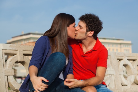 Happy Young Couple Kissingの写真素材