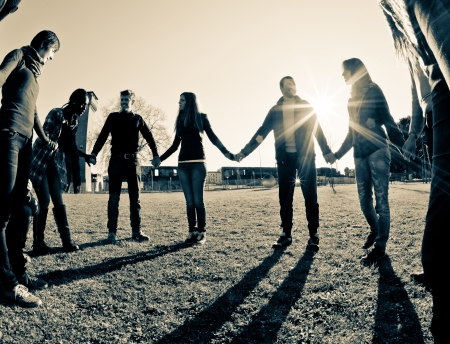 Multiracial Young People Holding Hands in a Circle Multiracial Young People Holding Hands in a Circle