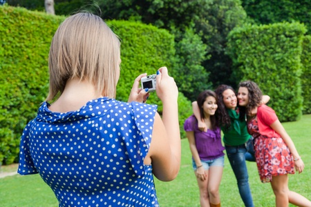 Girl Taking Photos to Her Friendsの写真素材