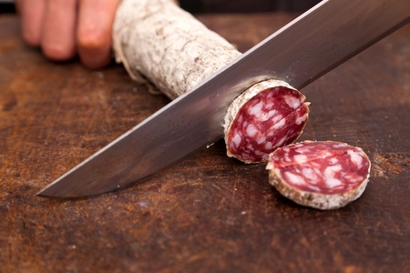 Butcher Slicing Salamiの写真素材