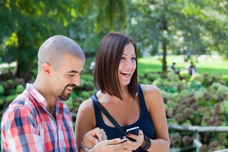 Happy Couple with Mobile Phoneの写真素材