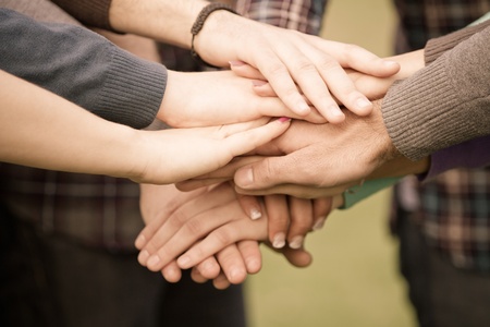 Multiracial Students with Hands on Stack