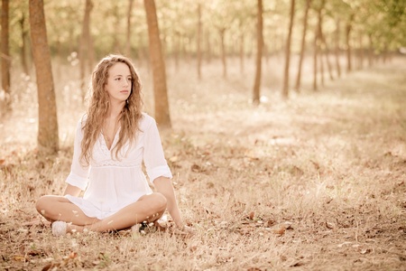 Young Woman doing Yoga Exercisesの写真素材