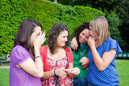 Female Teenagers Looking Photos in the Cameraの写真素材
