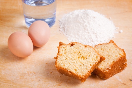 Slices of Cake with Raw Ingredients and Dessert Wine Glassの写真素材