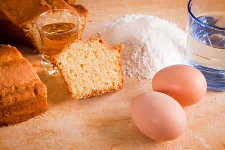 Slices of Cake with Raw Ingredients and Dessert Wine Glassの写真素材
