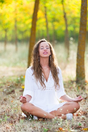 Young Woman doing Yoga Exercisesの写真素材