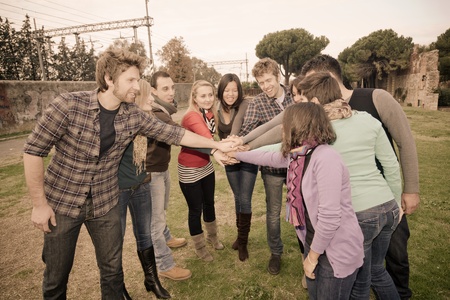 Multiracial Students with Hands on Stack