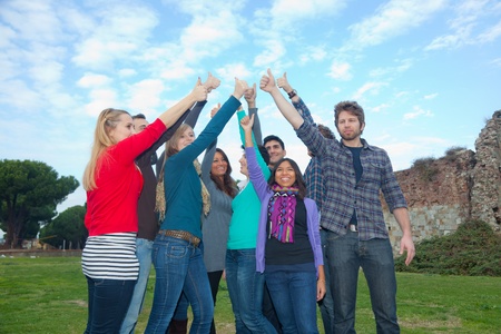 College Students with Thumbs Upの写真素材