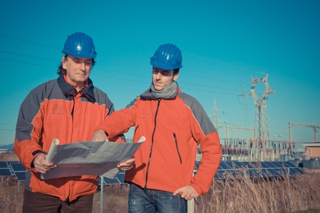 Engineers at Work In a Solar Power Stationの写真素材