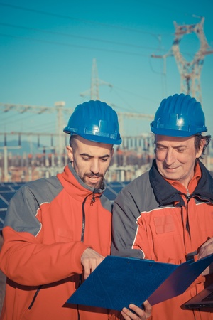 Engineers at Work In a Solar Power Stationの写真素材