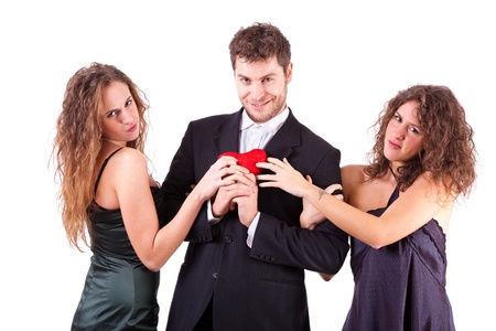 Handsome Man with two Women Flirtingの写真素材