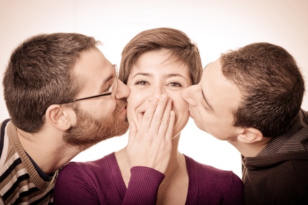 Young Woman and Two Menの写真素材