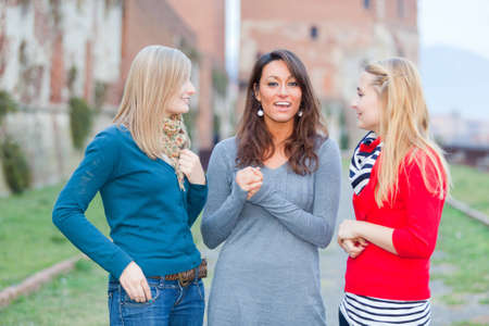 Three Women Chatting Outdoorの写真素材