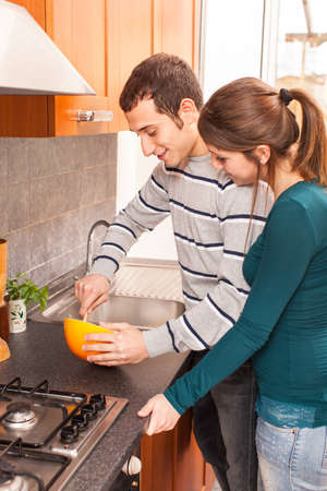 Wife and Husband Cooking Together in the Kitchenの写真素材