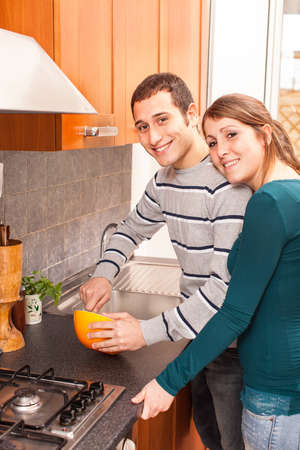 Wife and Husband Cooking Together in the Kitchenの写真素材