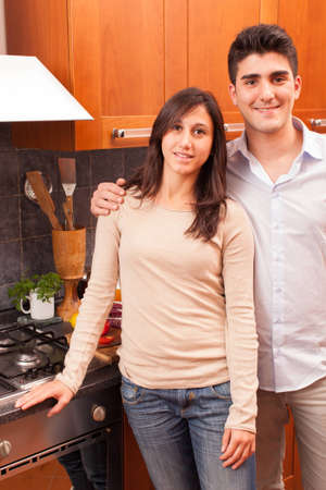 Happy Young Couple in the Kitchenの写真素材