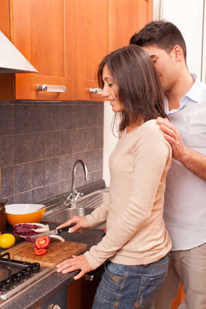 Happy Young Couple in the Kitchenの写真素材