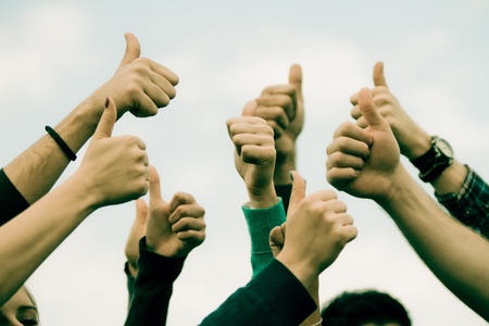 College Students with Thumbs Upの写真素材
