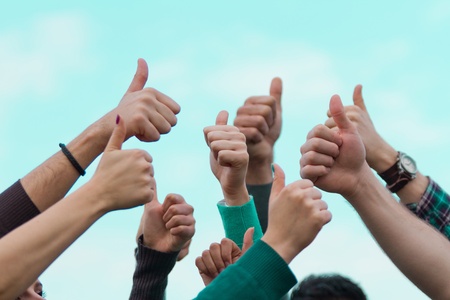 College Students with Thumbs Upの写真素材