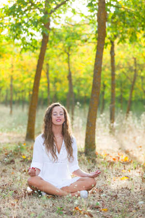 Young Woman doing Yoga Exercisesの写真素材