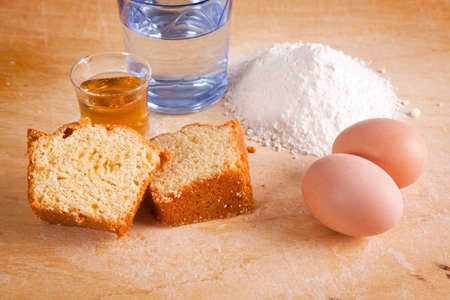 Slices of Cake with Raw Ingredients and Dessert Wine Glassの写真素材