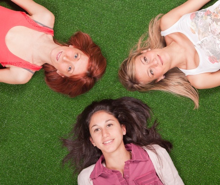 Young Girls Lying on the Groundの写真素材