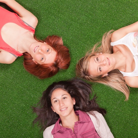 Young Girls Lying on the Groundの写真素材