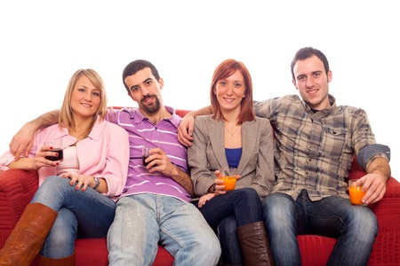 Young Group Sitting on Sofa and Drinkingの写真素材
