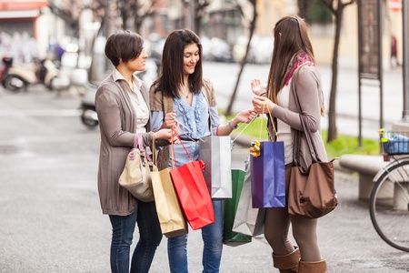 Three Beautiful Young Women doing Shoppingの写真素材