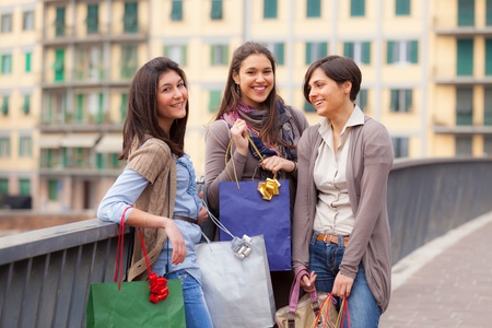 Three Beautiful Young Women with Shopping Bagsの写真素材