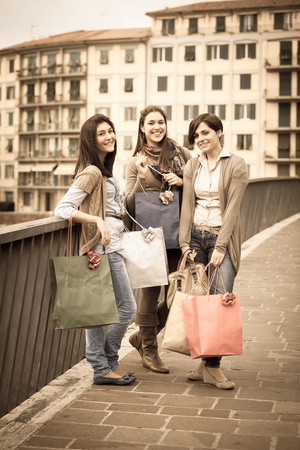Three Beautiful Young Women with Shopping Bagsの写真素材