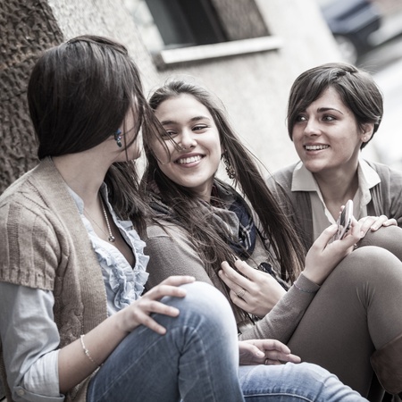Group of Women Sending Message with Mobile Phoneの写真素材