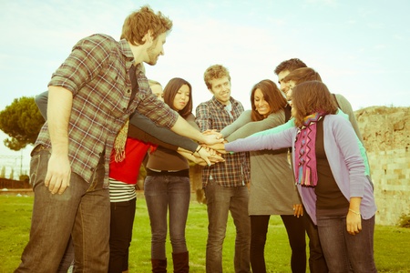 Multiracial Students with Hands on Stackの写真素材
