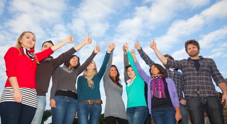 College Students with Thumbs Upの写真素材