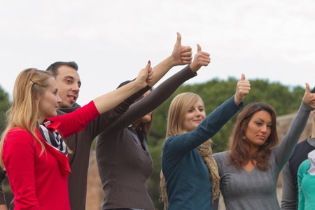 College Students with Thumbs Upの写真素材