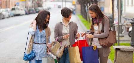 Three Beautiful Young Women doing Shoppingの写真素材