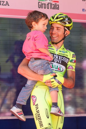 SERAVEZZA, LUCCA, ITALY - MAY 17: Elia Favilli, Team Farnese Vini, with his son, before the 12th stage of 2012 Giro d'Italia on May 17, 2012 in Seravezza, Lucca, Italyのeditorial素材
